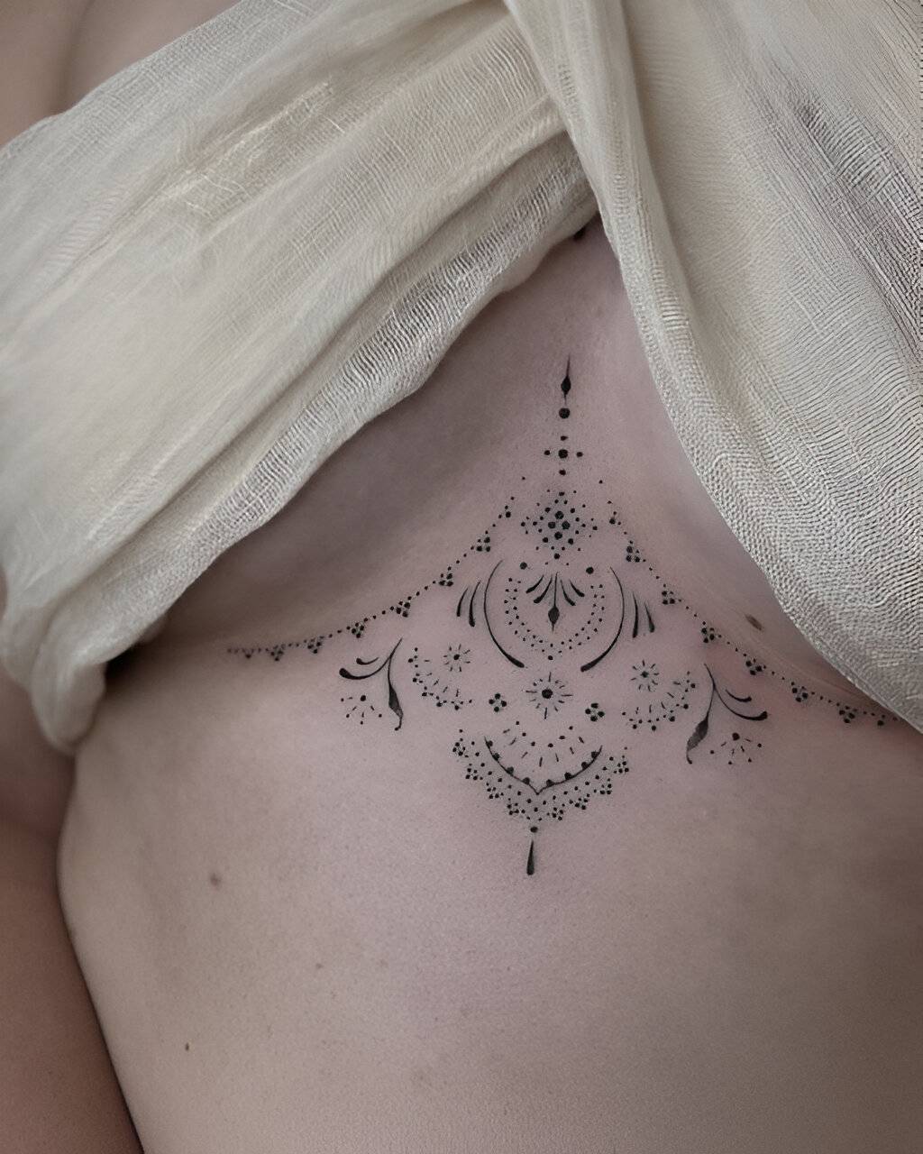 27 Elegant Chest Tattoos For Women To Elevate Their Beauty 10