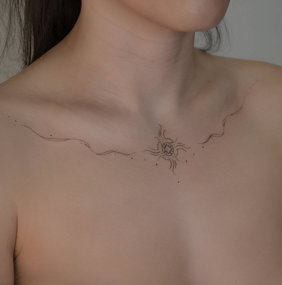 27 Elegant Chest Tattoos For Women To Elevate Their Beauty 11