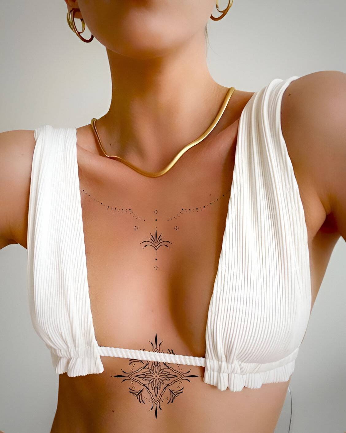 27 Elegant Chest Tattoos For Women To Elevate Their Beauty 5