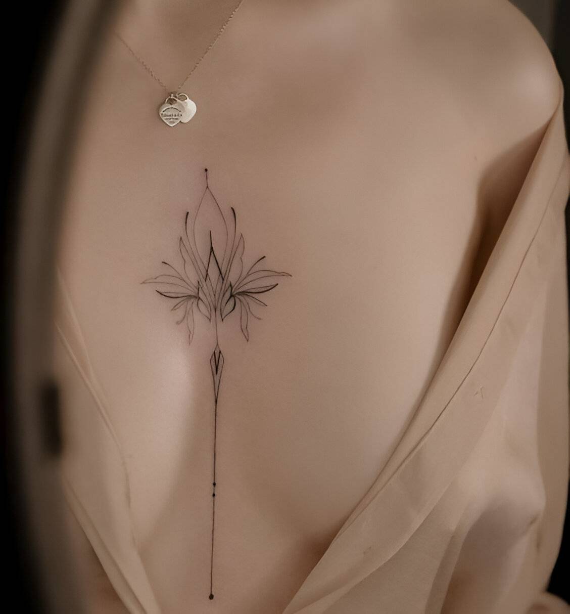 27 Elegant Chest Tattoos For Women To Elevate Their Beauty 7