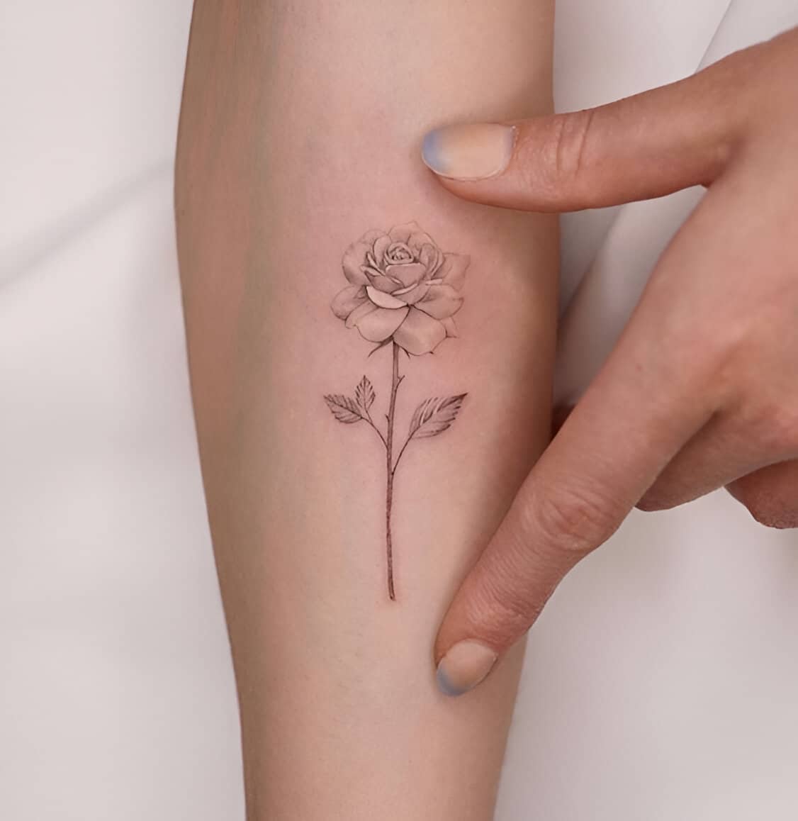 30 Elegant Feminine Rose Tattoos To Maximize Your Charm 29