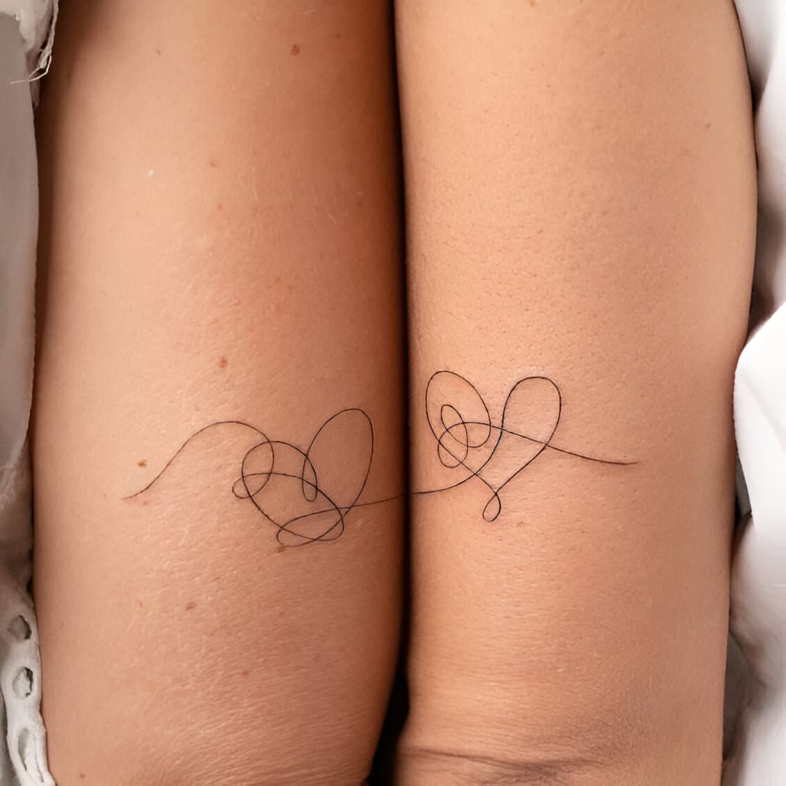 30 Elegant Matching Heart Tattoos To Get With Your Partner ASAP 22