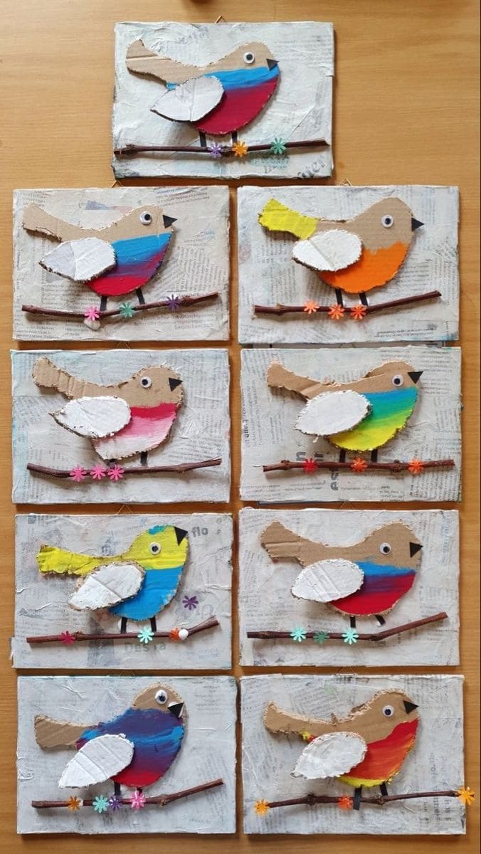 Colorful Cardboard Birds on Rustic Branches