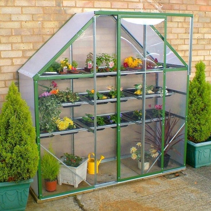 Compact Polycarbonate Greenhouse With Multi-Level Plant Shelves