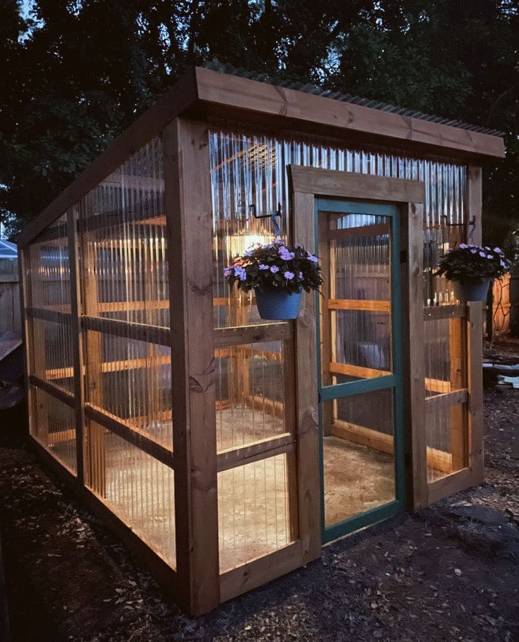 DIY Greenhouse with Rustic Wooden Frame and Clear Corrugated Panels