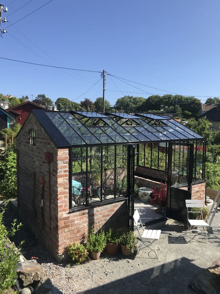 Rustic Brick-Base Greenhouse with Modern Glass Roof