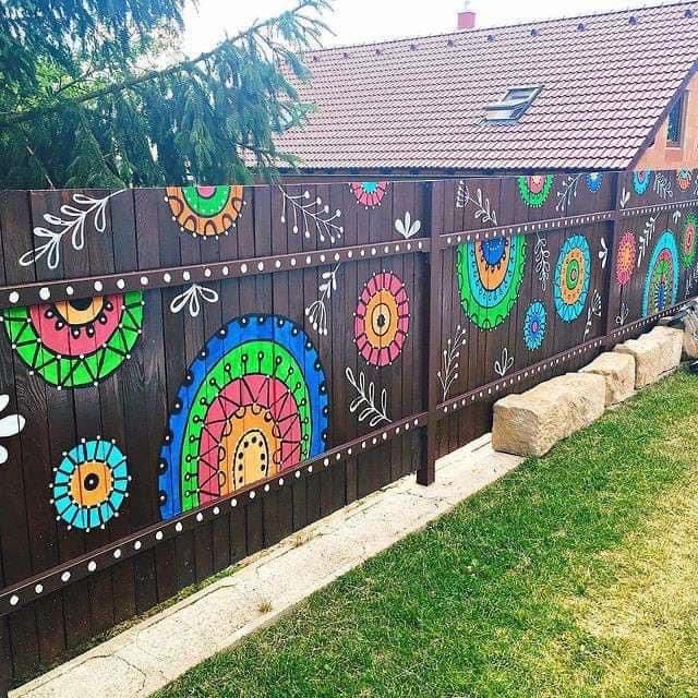 Vibrant Hand-Painted Fence with Artistic Charm