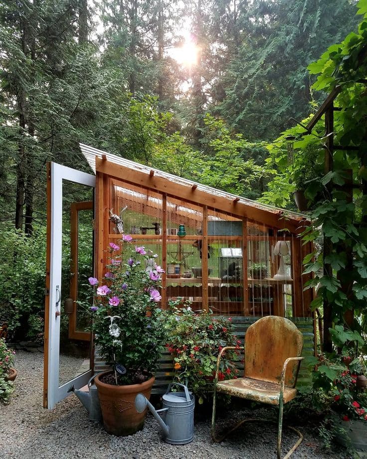 Wooden Greenhouse Surrounded by Lush Gardens